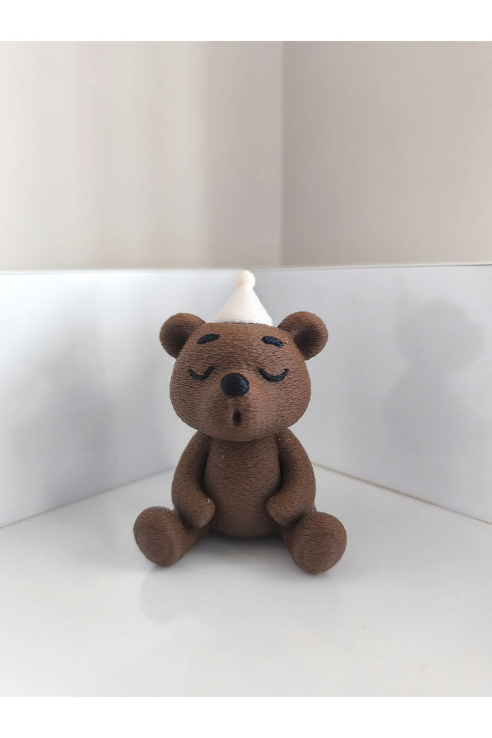 Add a playful touch to your space with the Alwin3d Cute Sitting Bear Blowing Candle Figurine Toy.