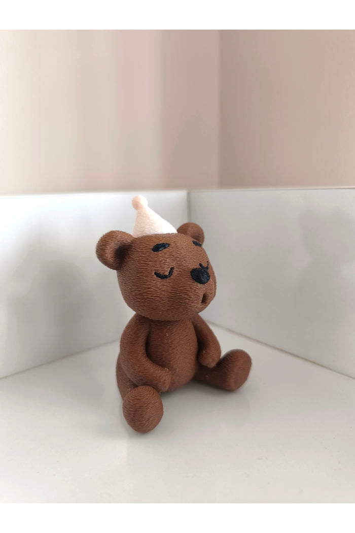 Add a playful touch to your space with the Alwin3d Cute Sitting Bear Blowing Candle Figurine Toy.